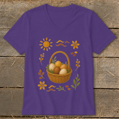 Purple t-shirt with Easter basket, eggs, sun, flowers, and leaves pattern.