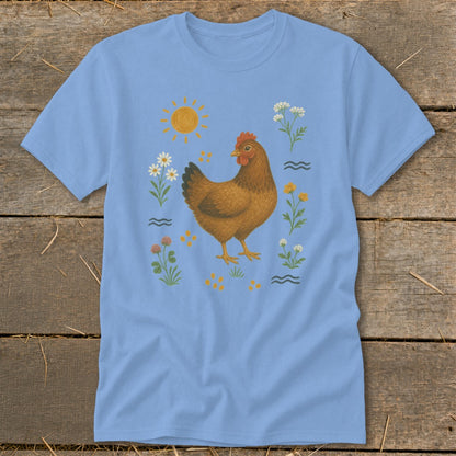 Light blue t-shirt with brown chicken, sun, flowers, and clover illustration.