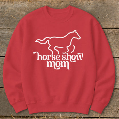 Red sweatshirt with white outline of a horse and text "horse show mom".