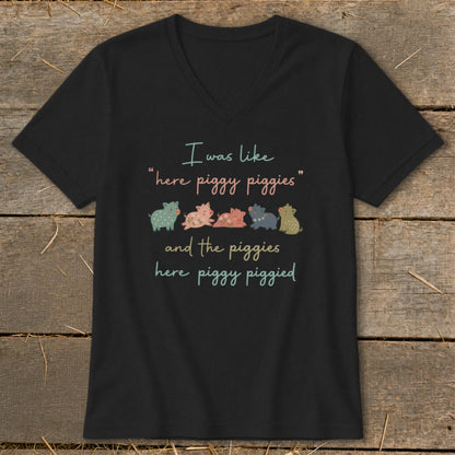 Black t-shirt with "I was like 'here piggy piggies' and the piggies here piggy piggied" and five colorful pigs.