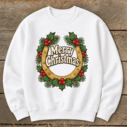 White sweatshirt with a horseshoe wreath graphic that says "Merry Christmas."