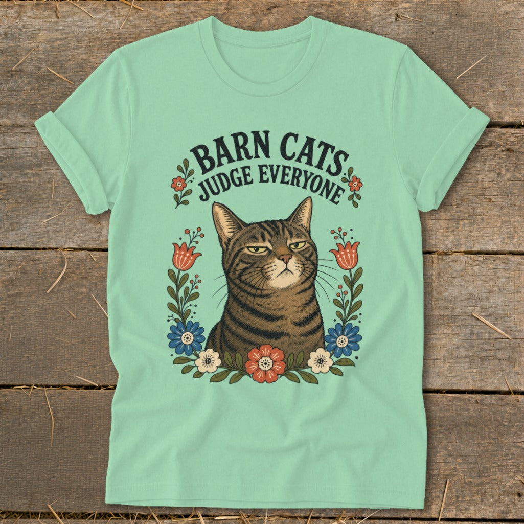 Mint t-shirt with a tabby cat and "Barn Cats Judge Everyone" text surrounded by flowers.