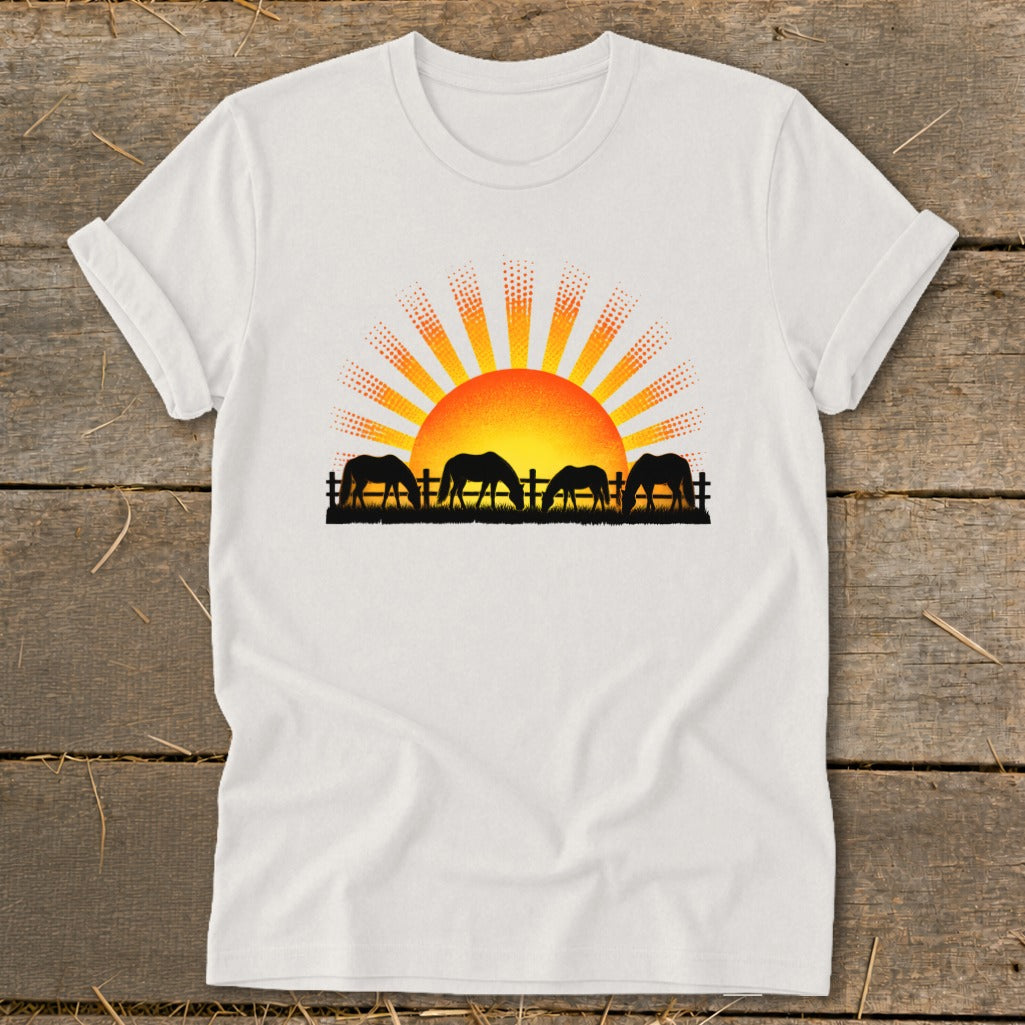 Four horses graze in a field with a stylized sunrise and fence.