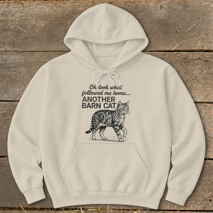 Cream hoodie with text "Oh look what followed me home... ANOTHER BARN CAT" and a cat illustration.