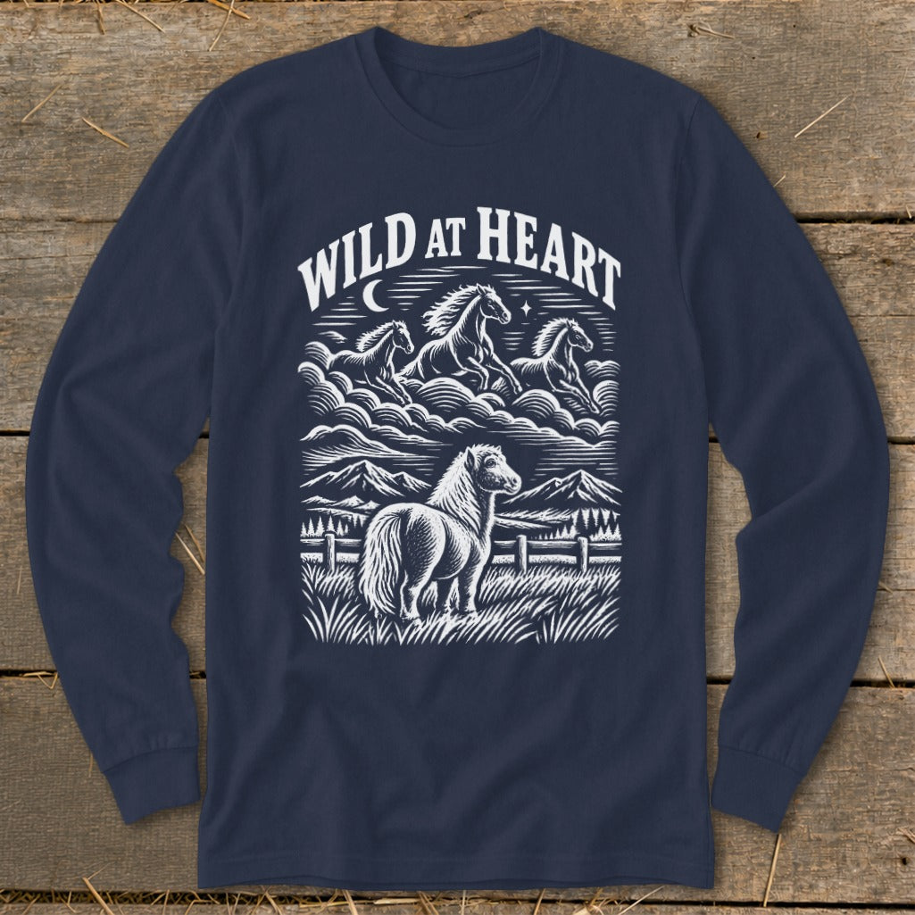 Navy blue long-sleeved t-shirt featuring a white graphic of horses, mountains, and the text Wild at Heart.