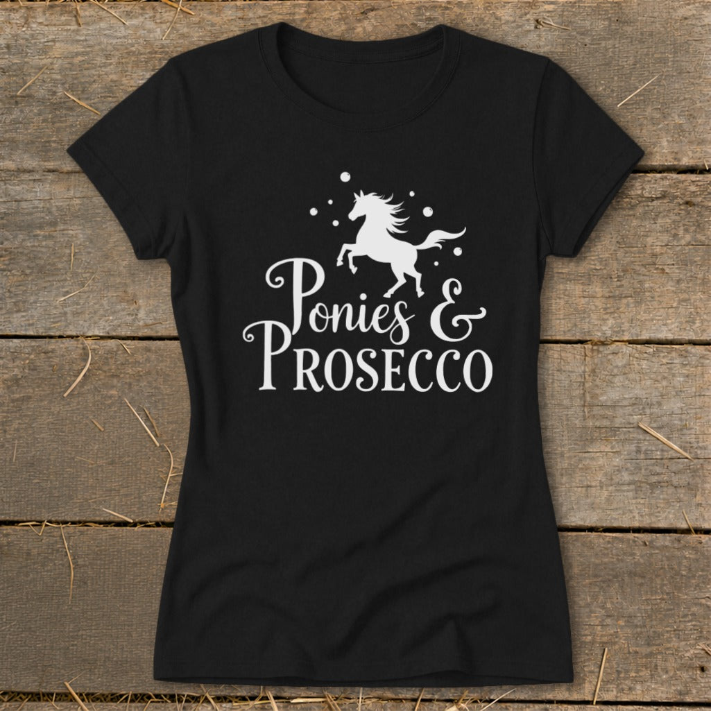 Black t-shirt with white graphic: a running pony above text "Ponies & Prosecco".