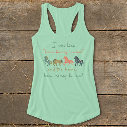 Mint tank top with text and graphic of four cartoon horses.