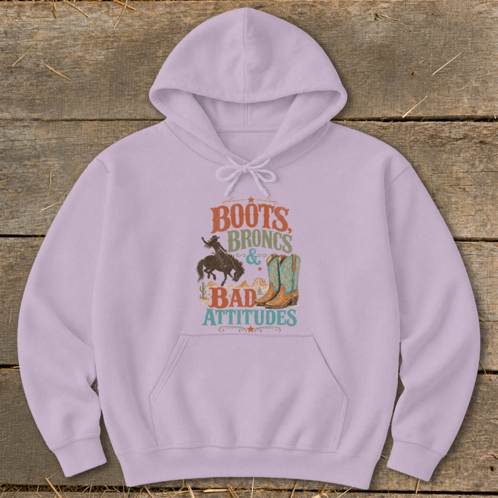 Lavender hoodie with graphic text "BOOTS BRONCS & BAD ATTITUDES".
