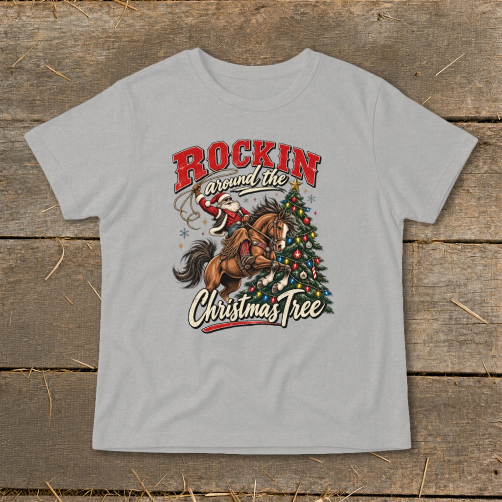 Santa riding a horse with lasso and Christmas tree, text "Rockin around the Christmas Tree".