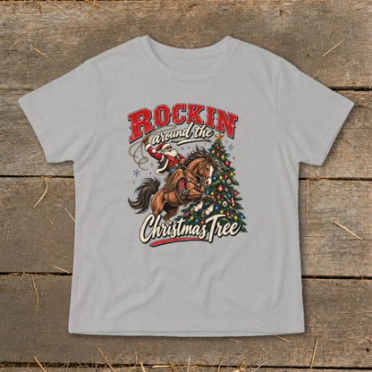 Santa riding a horse with lasso and Christmas tree, text "Rockin around the Christmas Tree".