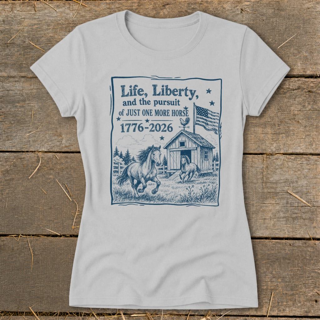 Grey t-shirt with a blue graphic of horses, barn, American flag and text.