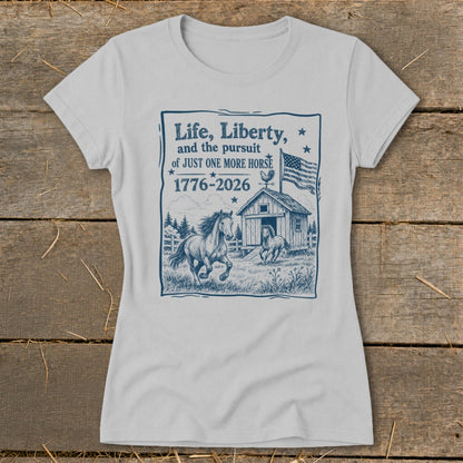 Grey t-shirt with a blue graphic of horses, barn, American flag and text.