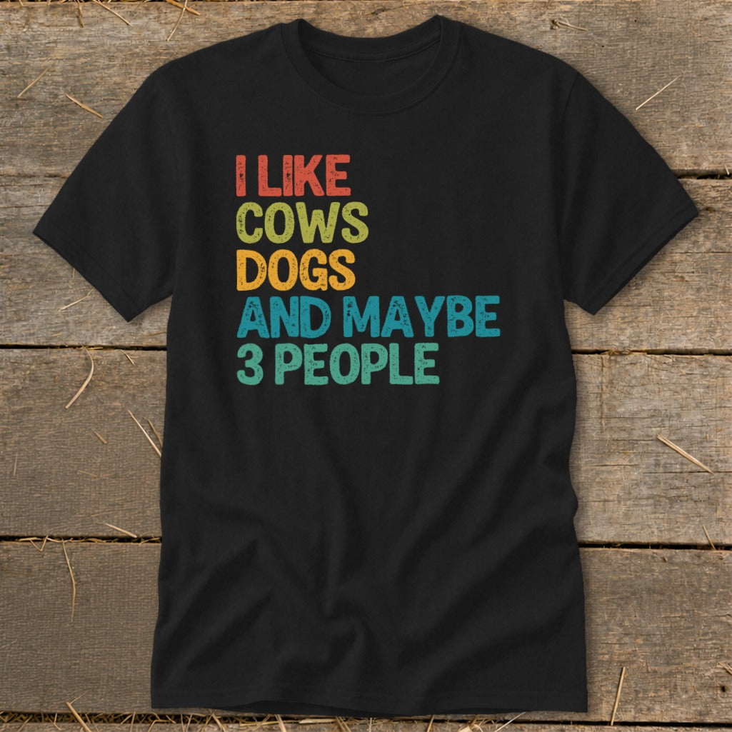 Black t-shirt with text "I LIKE COWS DOGS AND MAYBE 3 PEOPLE".
