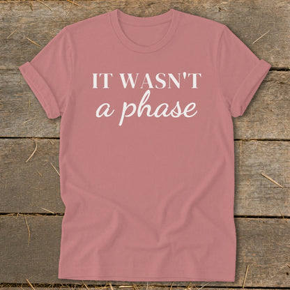Pink t-shirt with white text reading "IT WASN'T a phase".