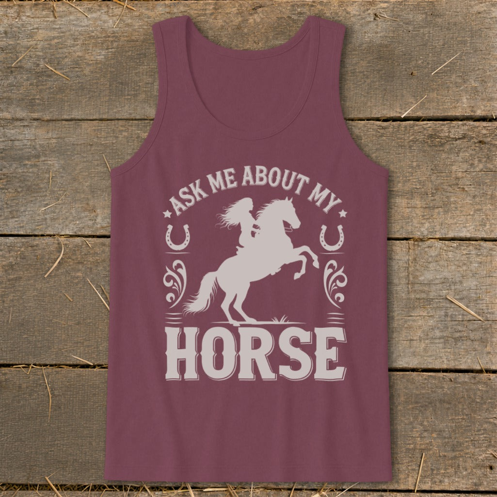 Burgundy tank top with white graphic of a woman on a rearing horse, horseshoes, and text.