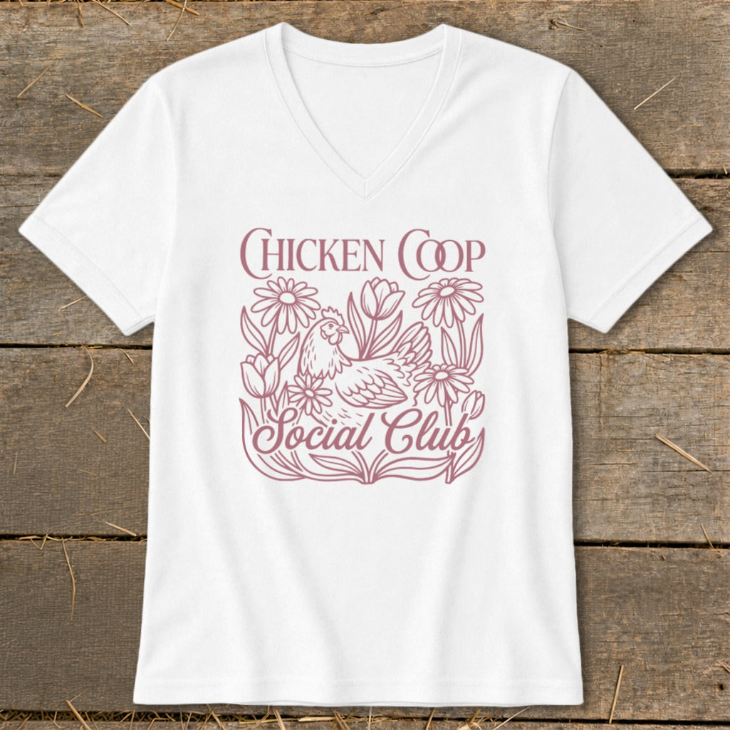 White v-neck t-shirt with "Chicken Coop Social Club" text and chicken and floral design.