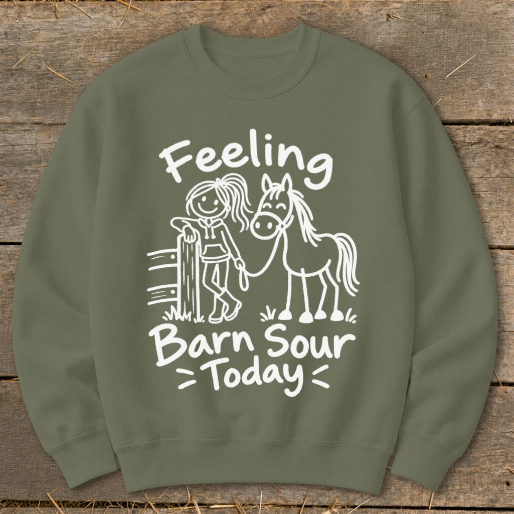 Olive green sweatshirt with white text and graphic of girl and horse.