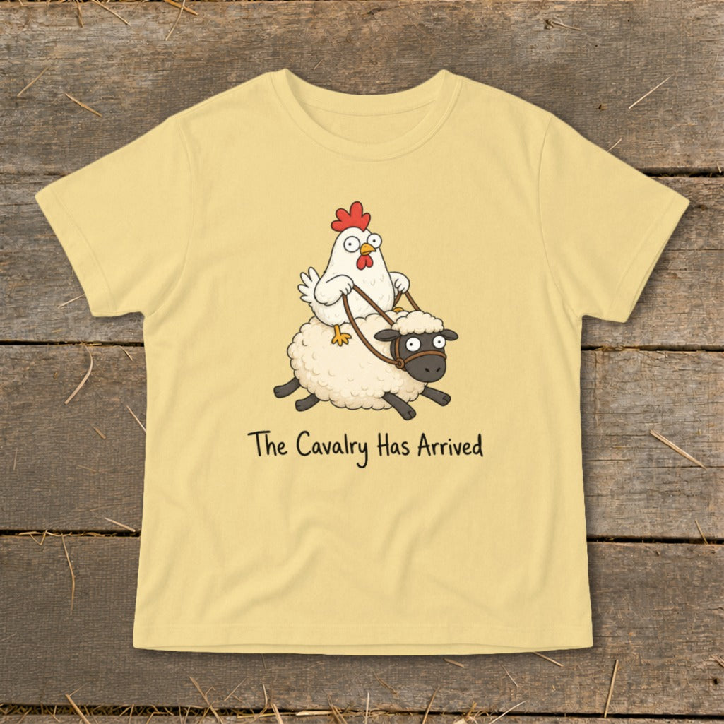 Light yellow t-shirt with cartoon chicken riding a sheep, text reads "The Cavalry Has Arrived".