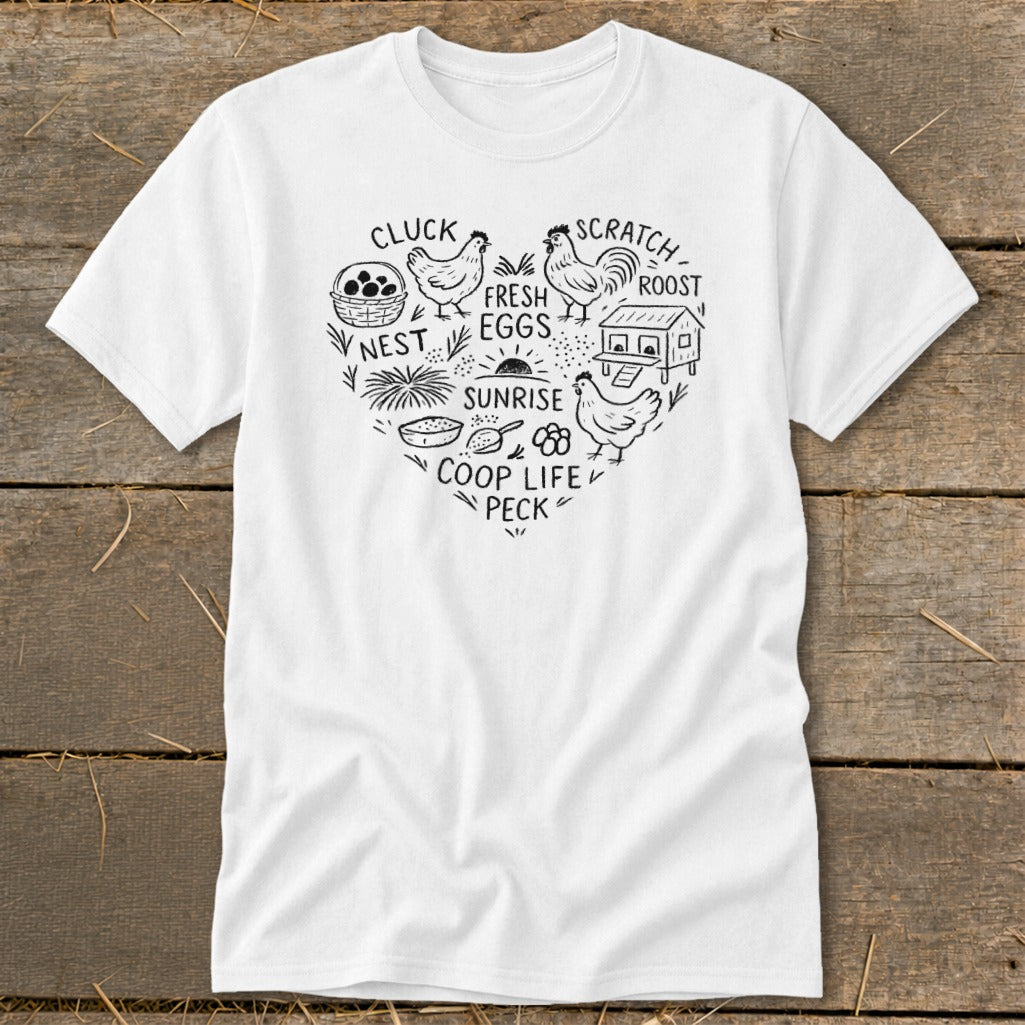 White t-shirt with heart-shaped chicken coop illustration and farm-related words.
