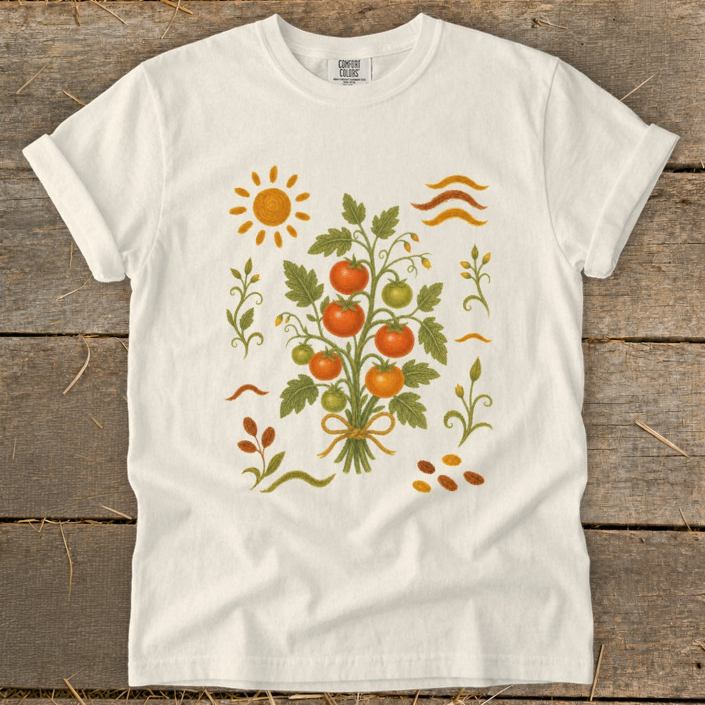 White t-shirt with a graphic of a tomato plant and sun.