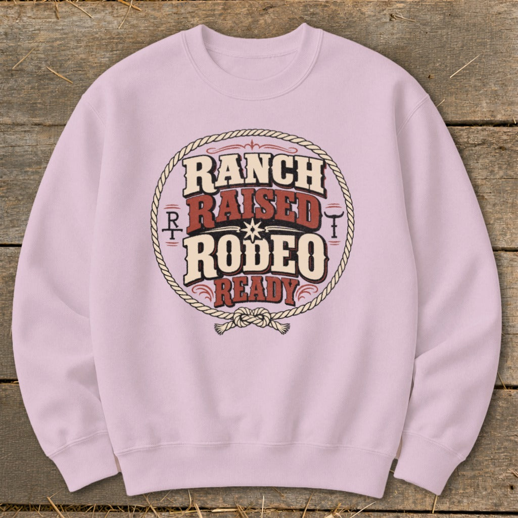 Light purple sweatshirt with "Ranch Raised Rodeo Ready" text in a circular rope design.