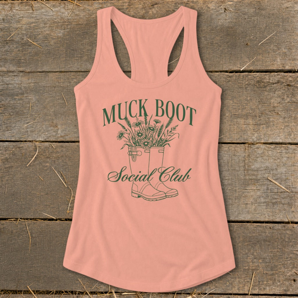 Peach tank top with green "Muck Boot Social Club" text and floral boots graphic.