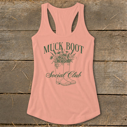 Peach tank top with green "Muck Boot Social Club" text and floral boots graphic.