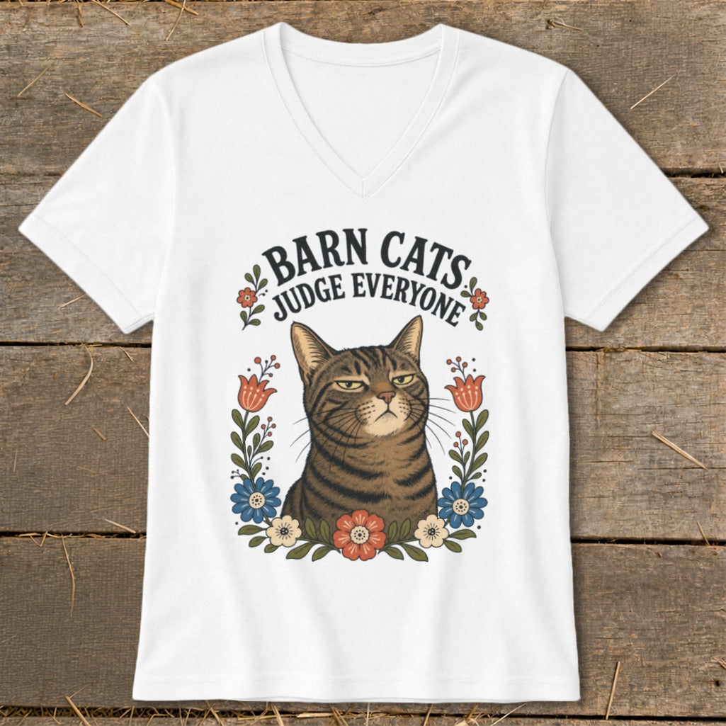 White v-neck t-shirt with a tabby cat and text "Barn Cats Judge Everyone."