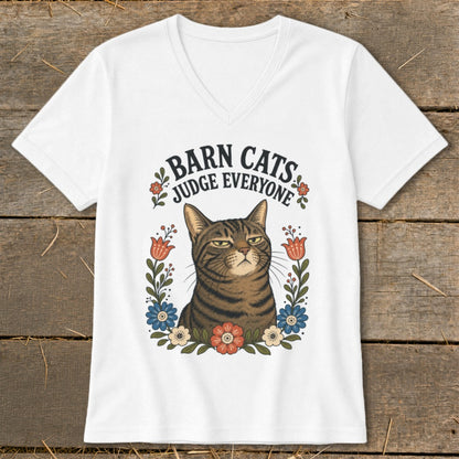 White v-neck t-shirt with a tabby cat and text "Barn Cats Judge Everyone."