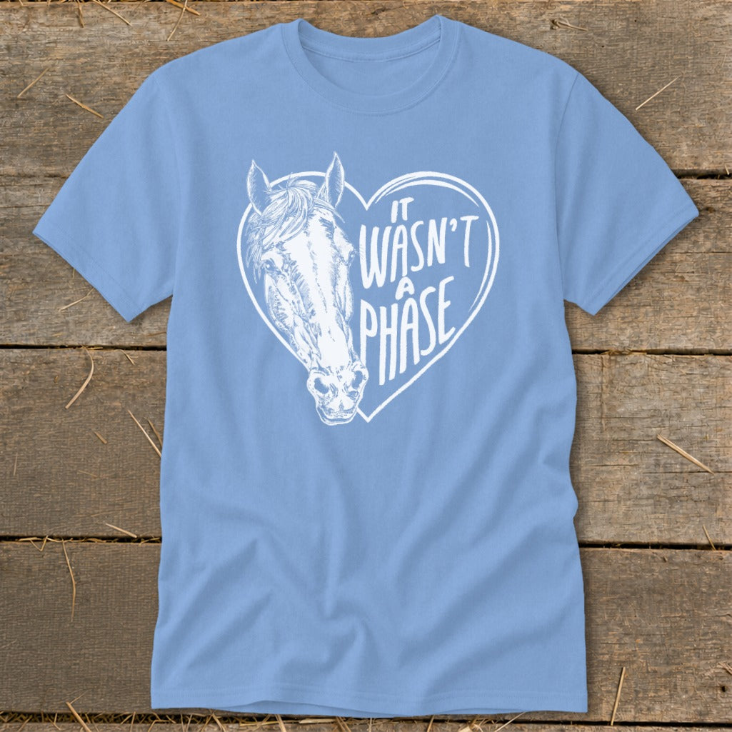 Light blue t-shirt with white horse head inside a heart and text.