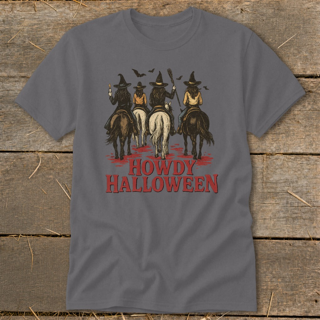 Four witches on horseback with bats overhead, text reads "Howdy Halloween".