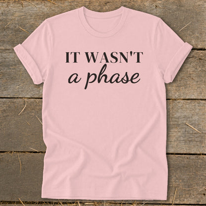 Pink t-shirt with black text reading "IT WASN'T a phase".