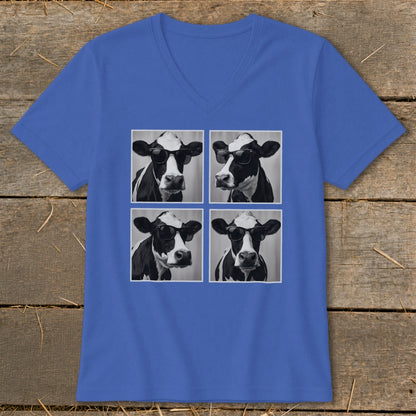 Four black and white cows wearing sunglasses on a blue t-shirt.