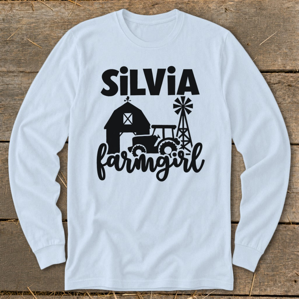 Light blue long-sleeve shirt with "Silvia farmgirl" and barn, tractor, windmill graphic.