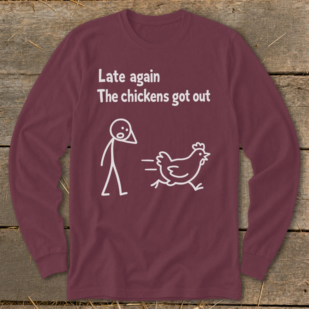 Maroon long-sleeve shirt with white text and cartoon of a person and running chicken.
