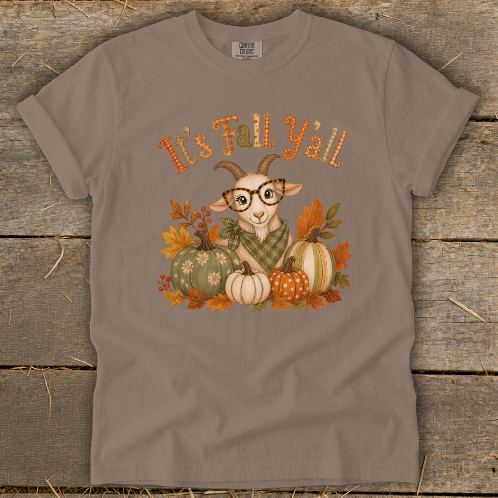 Goat with glasses and pumpkins surrounded by fall leaves, text "It's Fall Y'all".