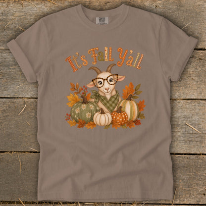 Goat with glasses and pumpkins surrounded by fall leaves, text "It's Fall Y'all".