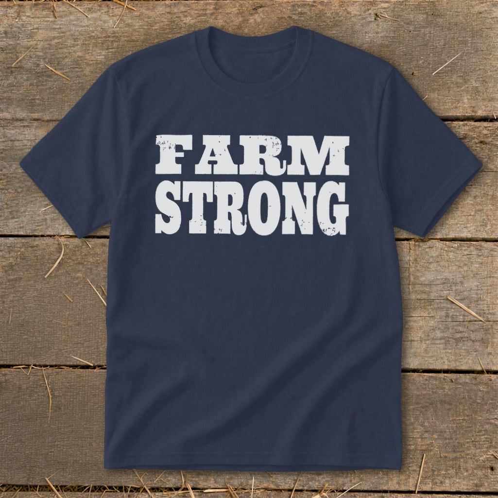 Navy blue short-sleeve t-shirt with distressed white text reading "FARM STRONG" displayed centrally.
