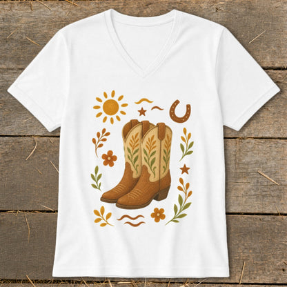 White v-neck t-shirt with cowboy boots, sun, horseshoe, and floral graphics.