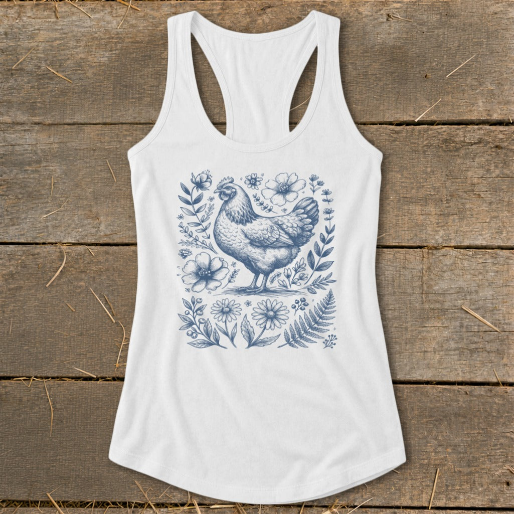 White tank top with a blue line drawing of a chicken surrounded by flowers.