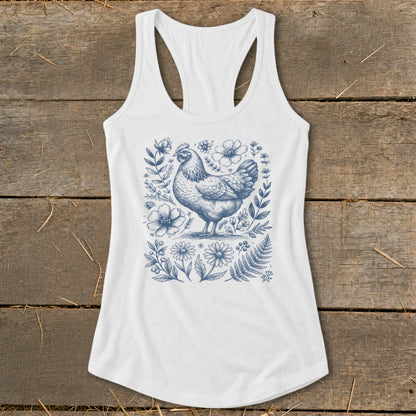 White tank top with a blue line drawing of a chicken surrounded by flowers.