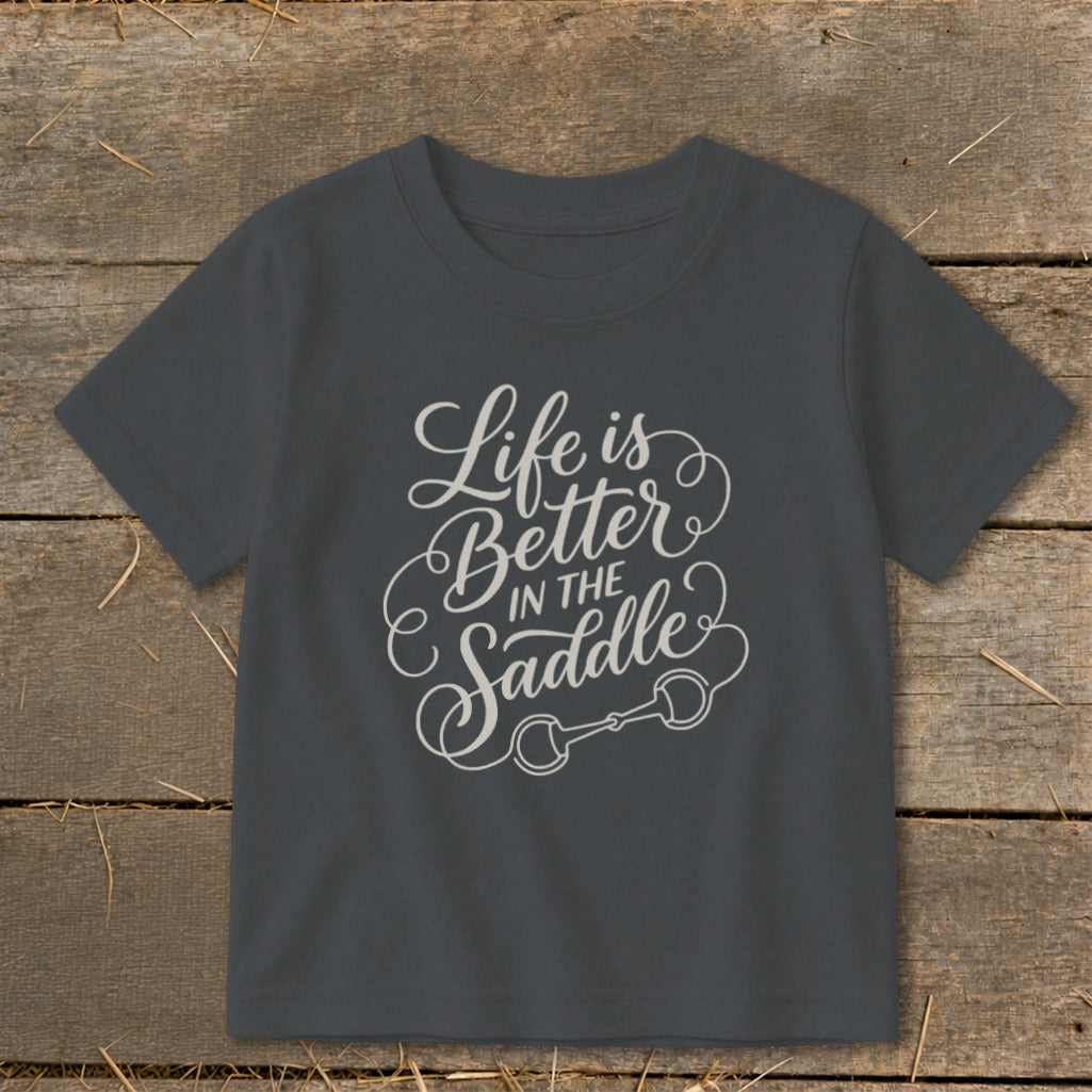 Dark gray t-shirt with "Life is Better in the Saddle" and horse bit design.