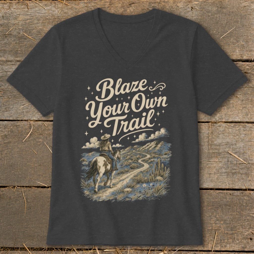 Dark grey t-shirt with "Blaze Your Own Trail" and horse rider in desert landscape graphic.