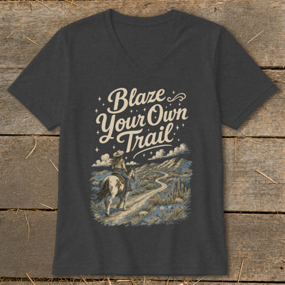 Dark grey t-shirt with "Blaze Your Own Trail" and horse rider in desert landscape graphic.