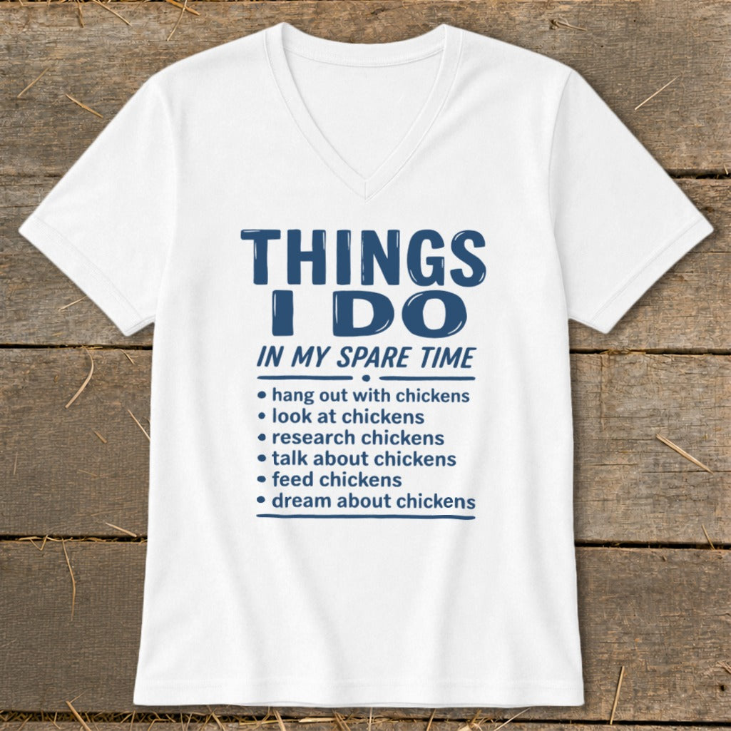 White t-shirt with blue text listing chicken-related activities in spare time.