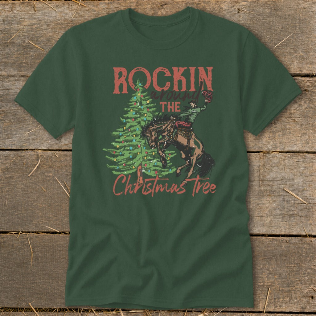 Green t-shirt with "Rockin' Around the Christmas Tree" and rodeo rider on a bucking horse.