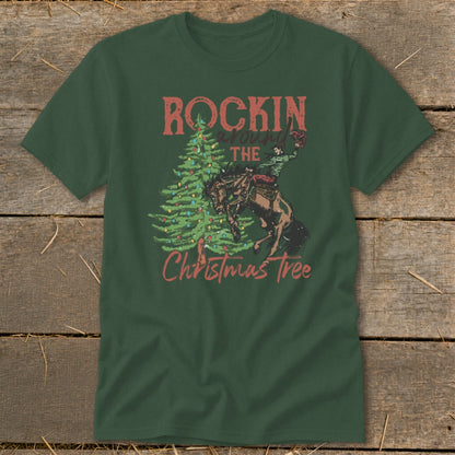 Green t-shirt with "Rockin' Around the Christmas Tree" and rodeo rider on a bucking horse.