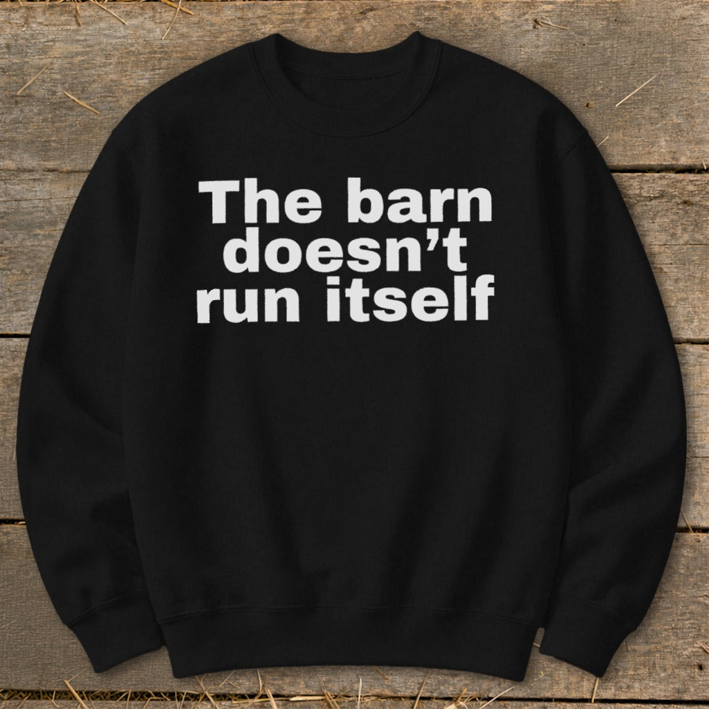 Black sweatshirt with white text that reads "The barn doesn't run itself".