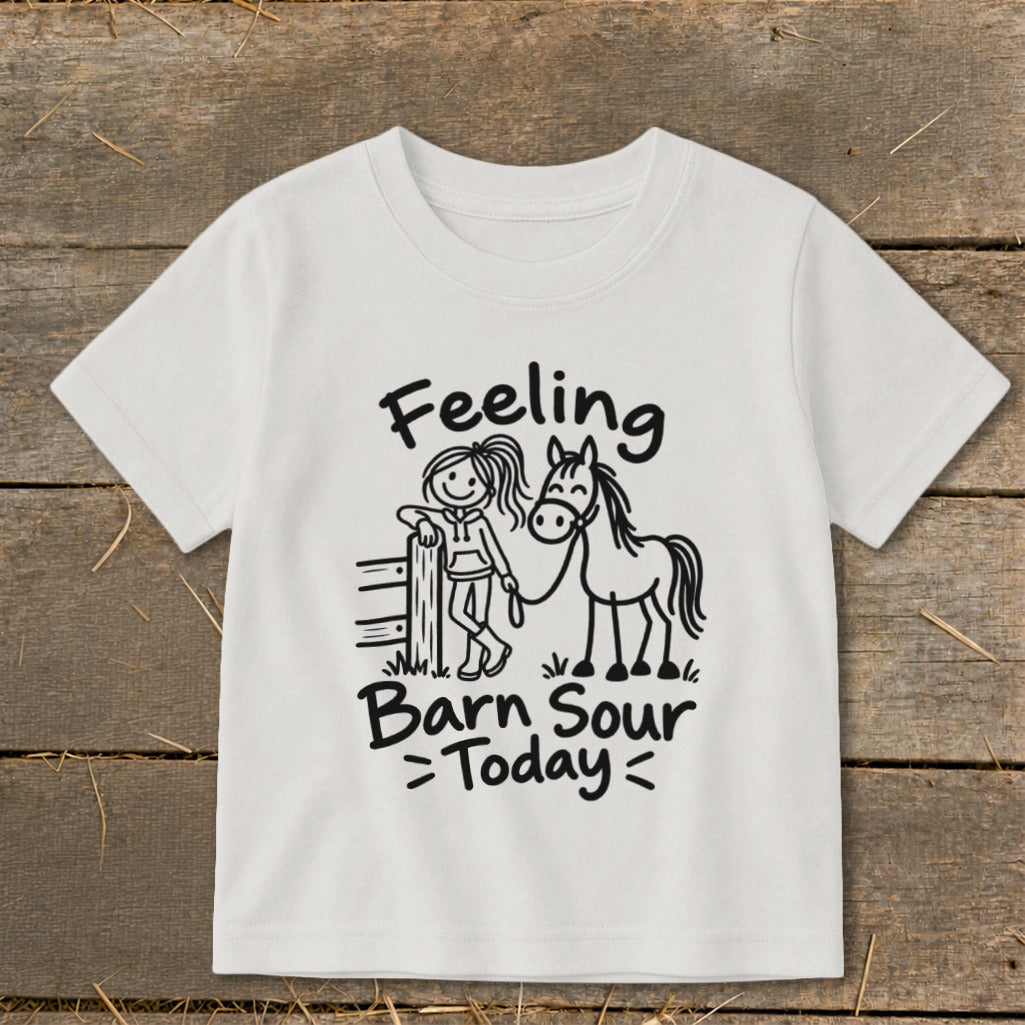 White t-shirt with cartoon girl and horse graphic and text "Feeling Barn Sour Today".