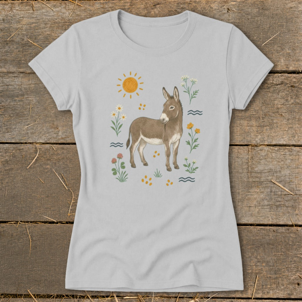 Light gray t-shirt with a watercolor-style illustration of a donkey surrounded by flowers and a sun.